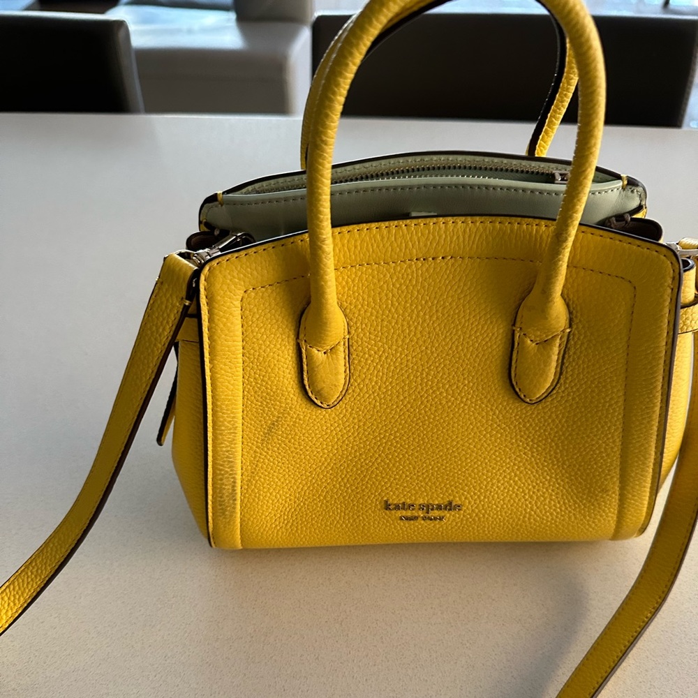 Kate spade yellow bag. I’m great condition only worn a handful of times.